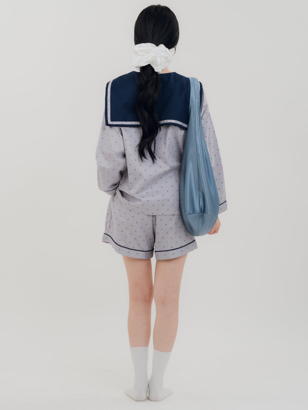 Woman back carrying the PEKGEE FairyTale Tote Bag as an elegant everyday bag.