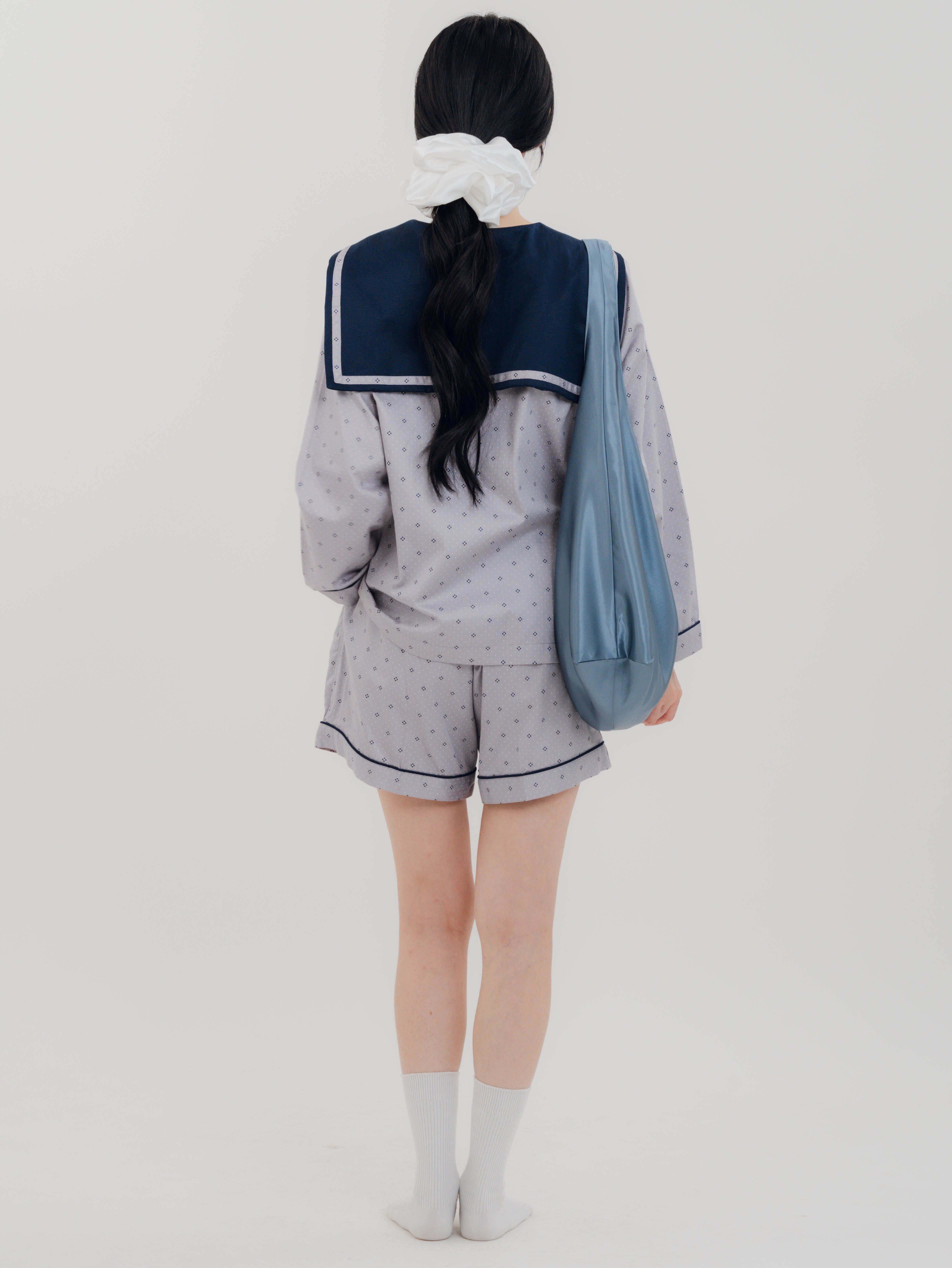Woman back carrying the PEKGEE FairyTale Tote Bag as an elegant everyday bag.