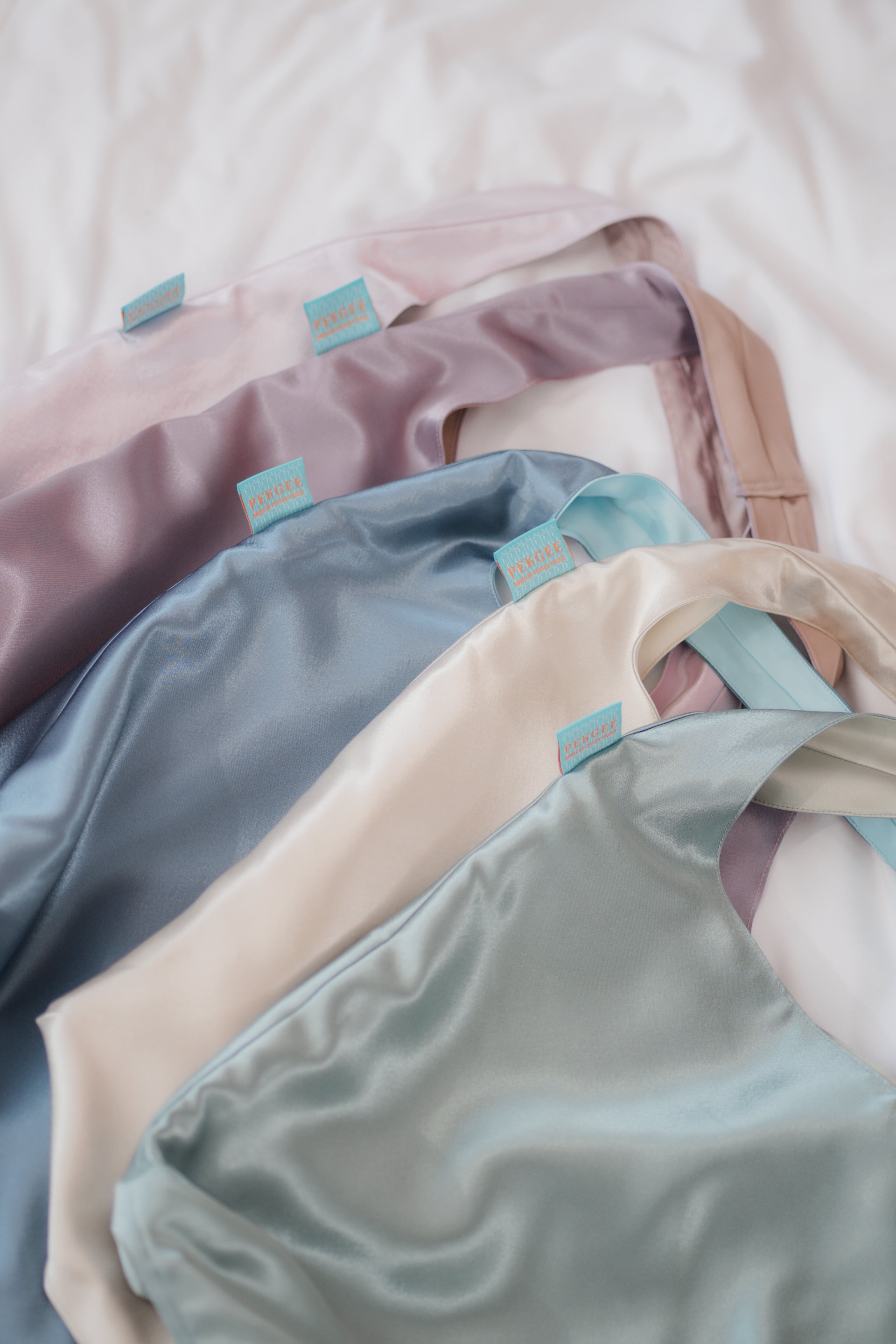 Close-up of the PEKGEE FairyTale Tote Bag showcasing the premium satin fabric, neat stitching, durable shoulder straps, and handcrafted details.