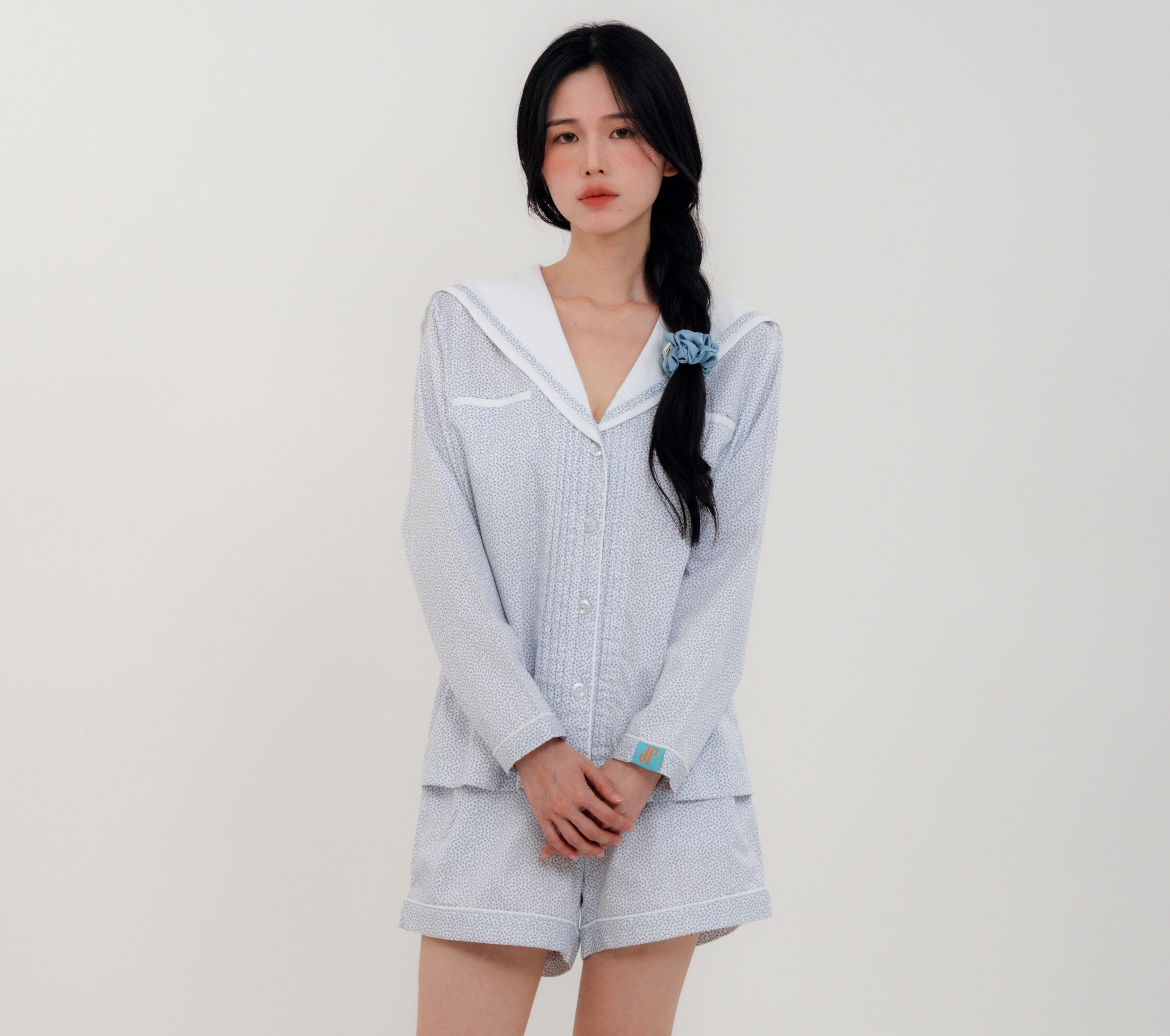 Front View
Woman wearing PEKGEE Sailorette Frosted Petals handmade premium cotton pyjama set.