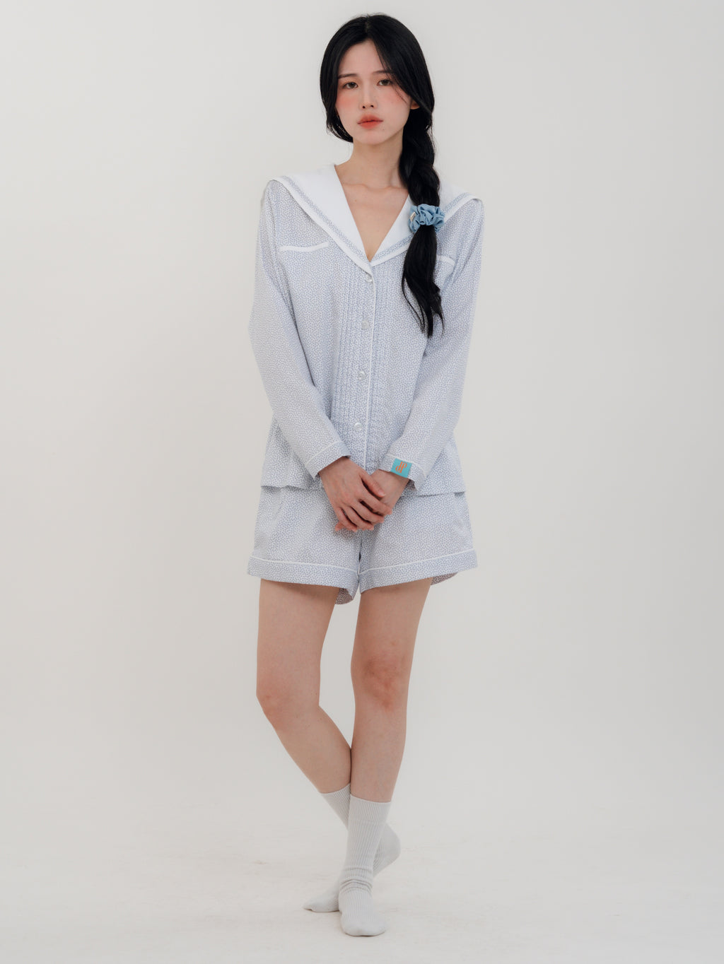 Front View
Woman wearing PEKGEE Sailorette Frosted Petals handmade premium cotton pyjama set.
