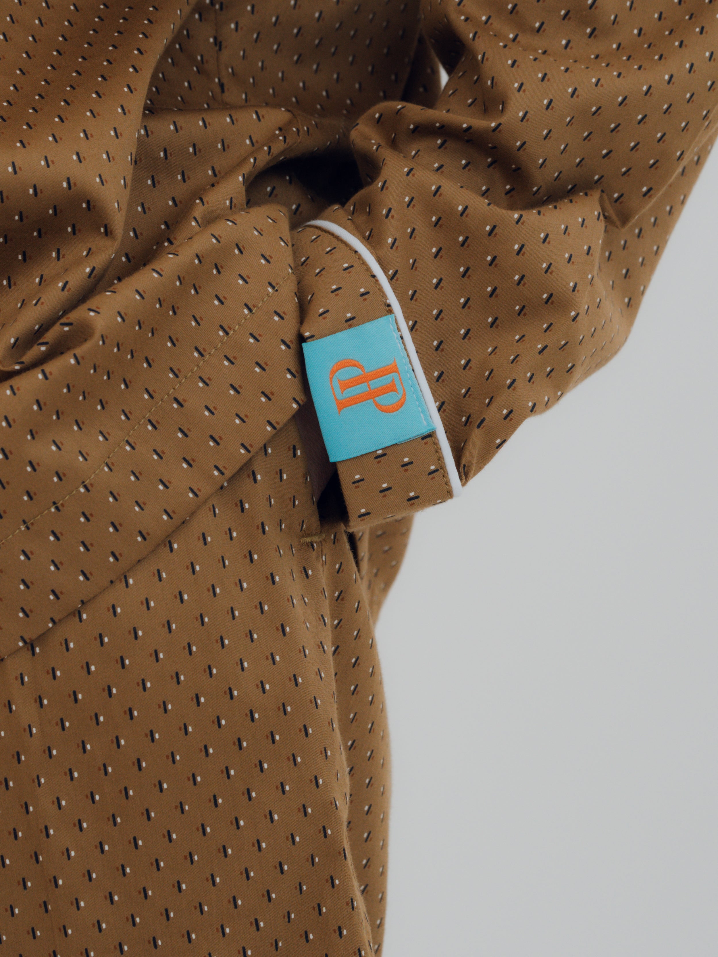 Close-up of the premium cotton fabric texture used in the PEKGEE Sailorette Golden Hour pyjama set.