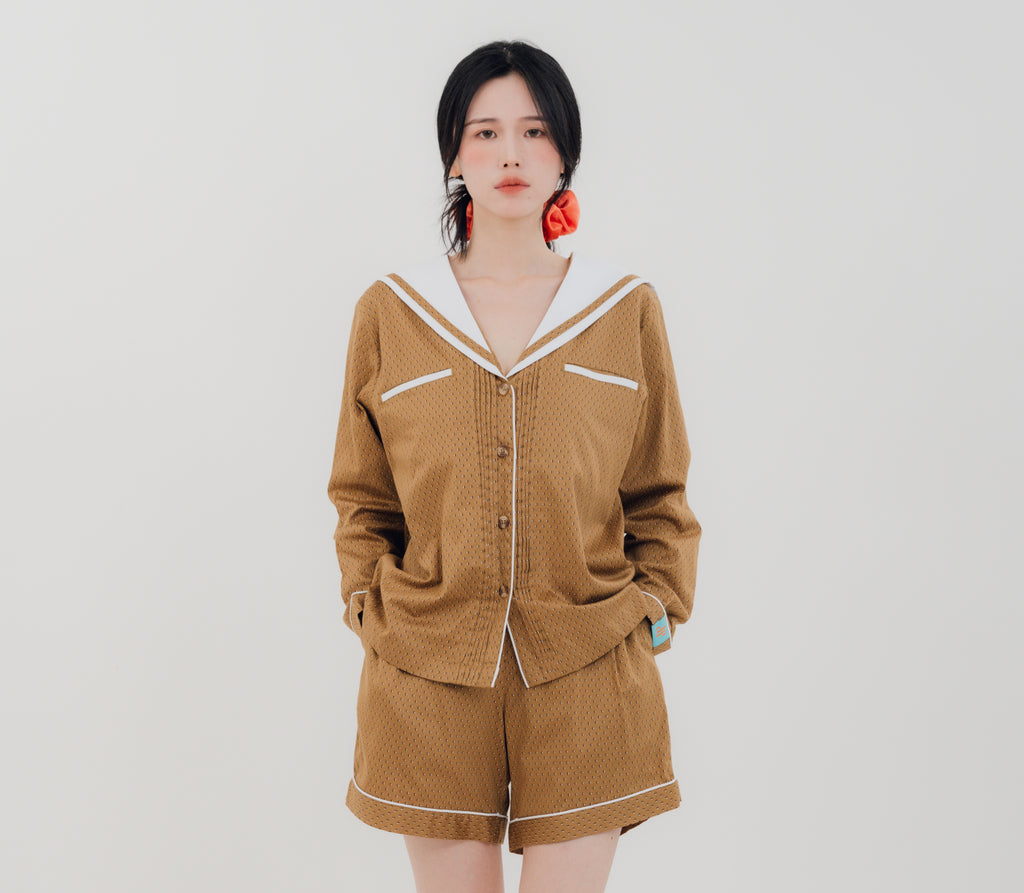 Front view Woman wearing PEKGEE Sailorette Golden Hour handmade premium cotton pyjama set.