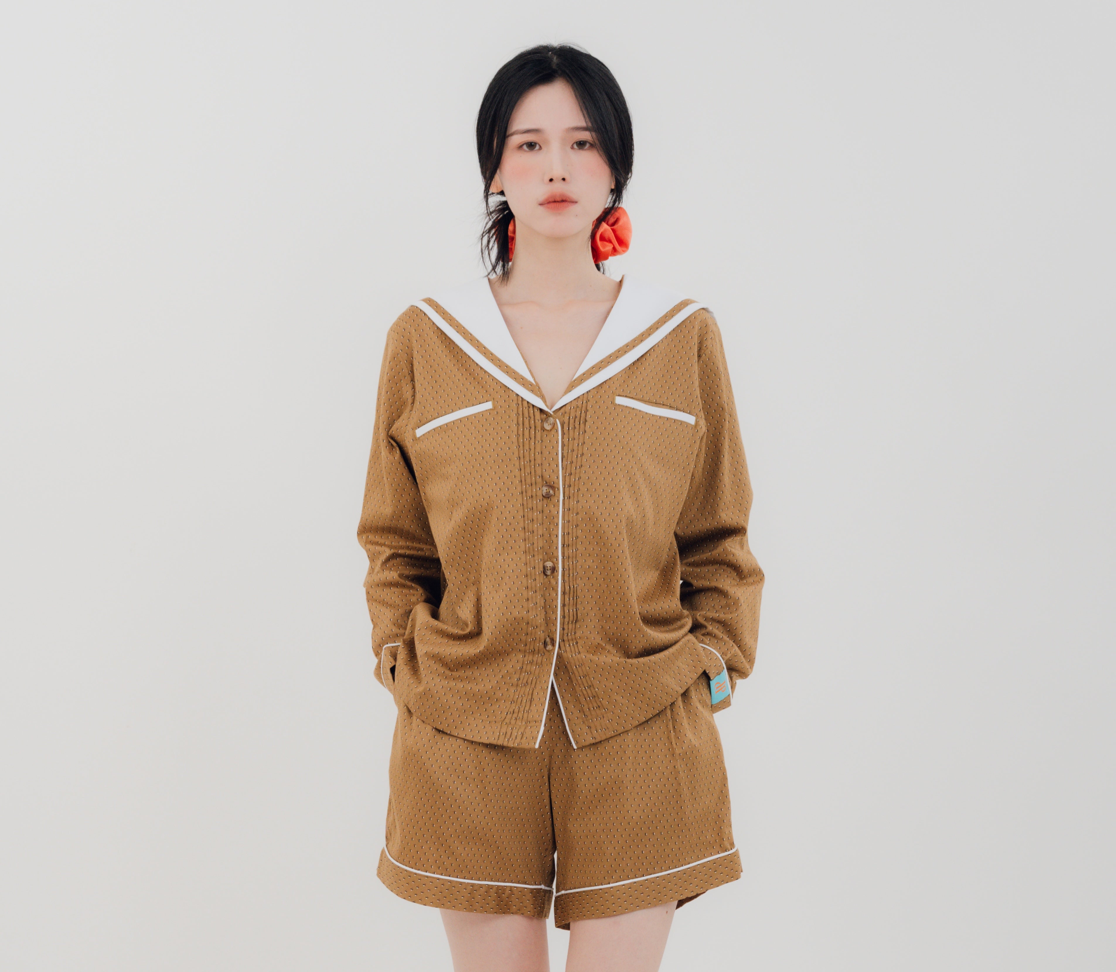 Front view Woman wearing PEKGEE Sailorette Golden Hour handmade premium cotton pyjama set.
