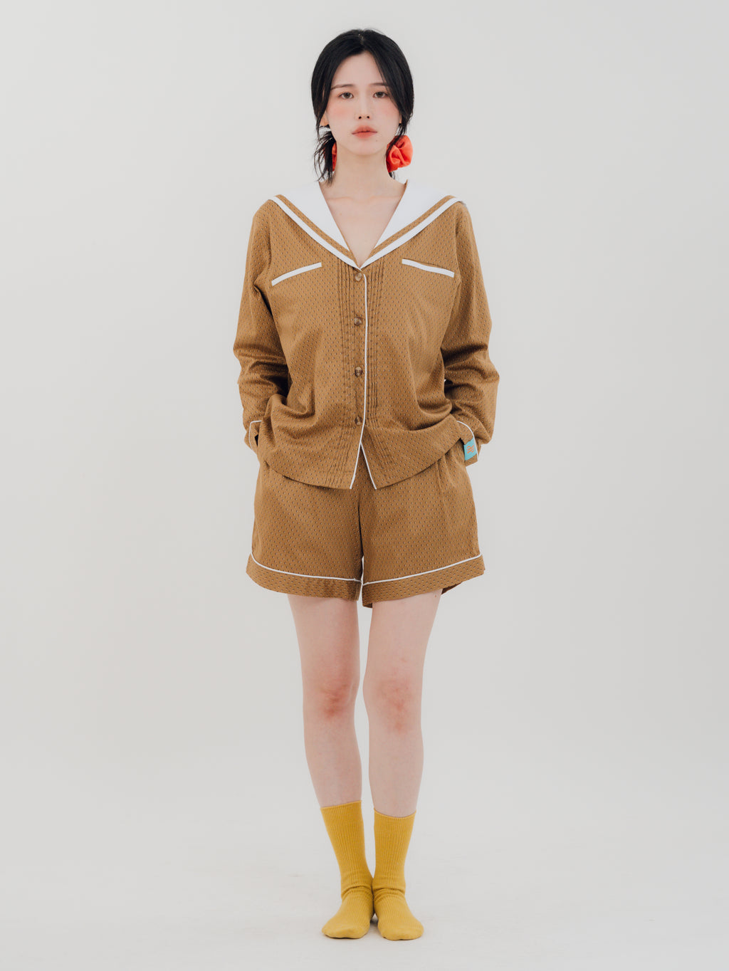 Front view Woman wearing PEKGEE Sailorette Golden Hour handmade premium cotton pyjama set.