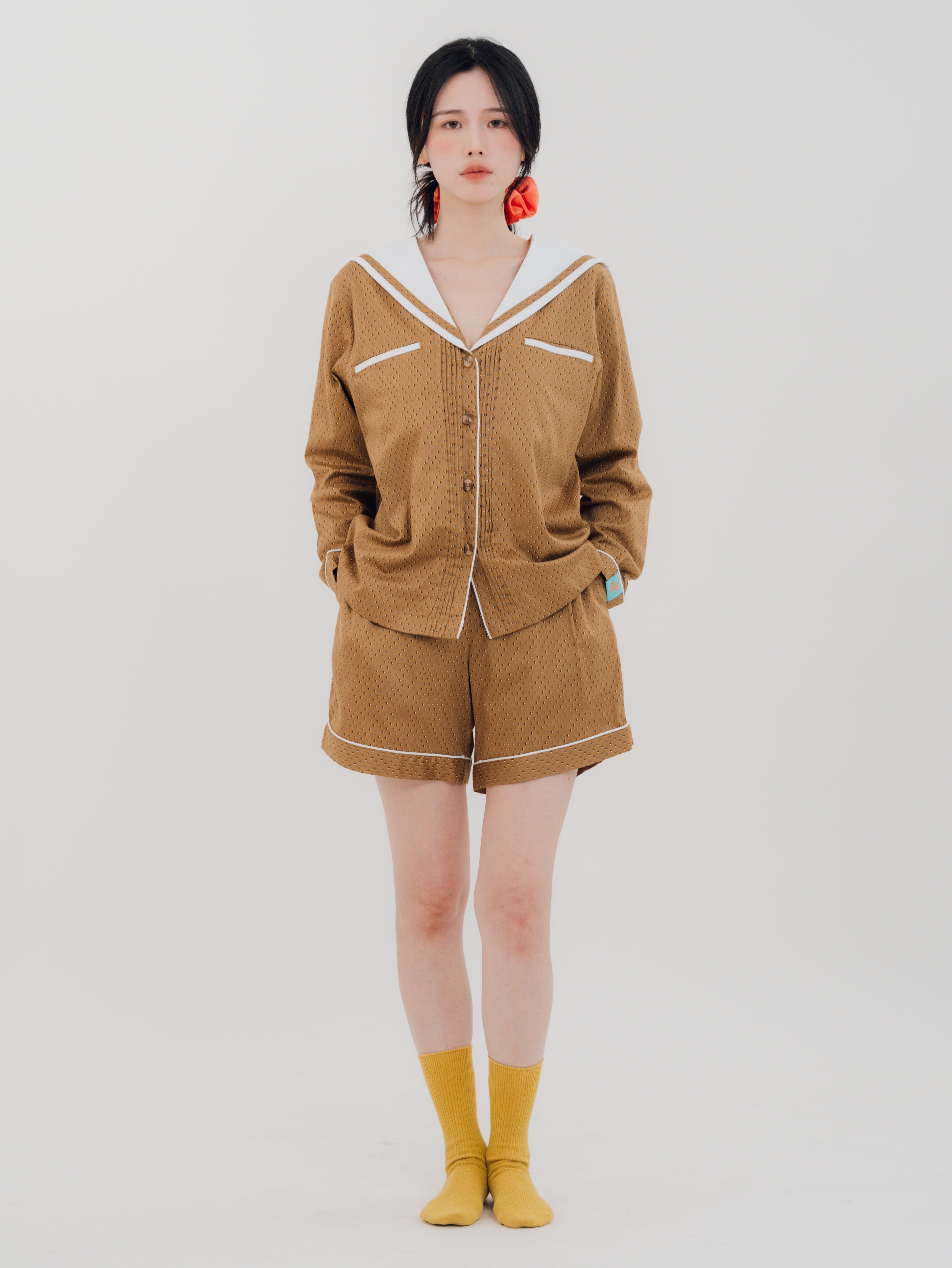 Front view Woman wearing PEKGEE Sailorette Golden Hour handmade premium cotton pyjama set.