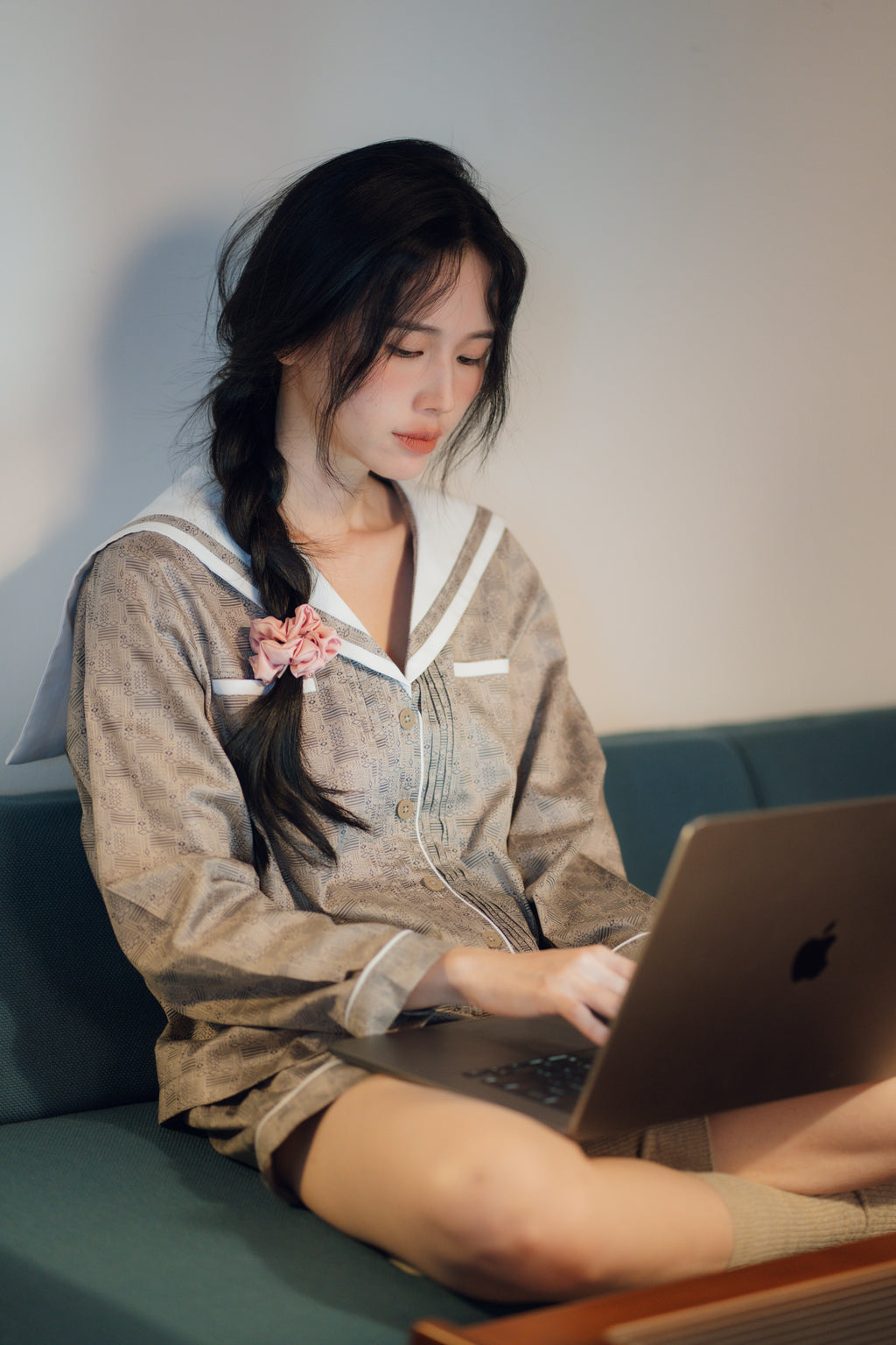 Woman wearing the PEKGEE Signature Satin Scrunchie in her hair.